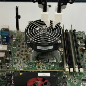 B. Near-miss trace, CPU fan: the gripper stops just short of the target (orange arrow).